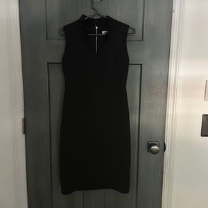 Calvin Klein | black dress, slightly below knee, ruffled v neck, gold zipper